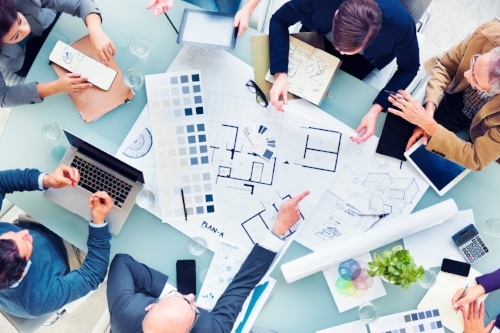 People working together around table with mobile devices-436352-edited.jpg