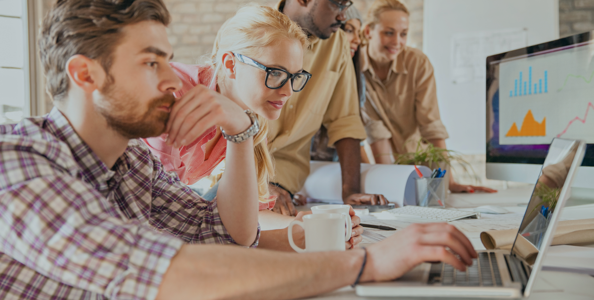 group-of-young-people-working-laptop-desktop-bg.png