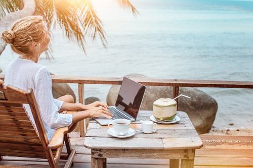 woman-beach-laptop-coconut.png