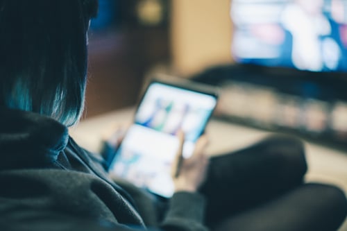 woman-casting-ipad-tv-nightime.jpg